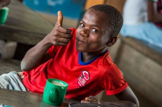 Child in Malawi enjoying Mary's Meals