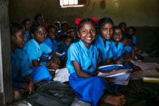 Image of child in classroom in India learning