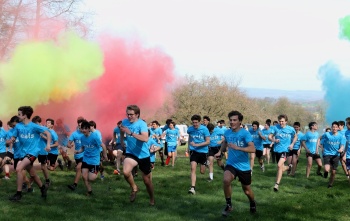 Fundraisers run among bright colours