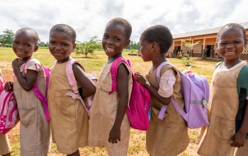 Children in Benin queuing for their school meal