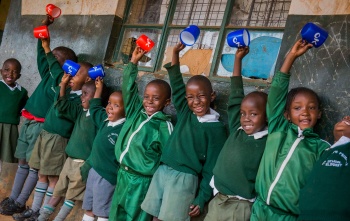 Children in Kenya waiting for their school meal