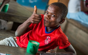 Child in Malawi enjoying Mary's Meals
