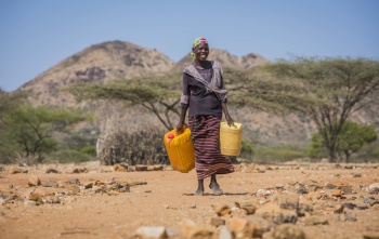 Rebecca carrying water in Kenya