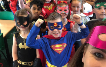 Primary pupils dressed in superhero costumes