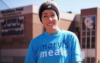 Eilish McColgan looks at camera while wearing Mary's Meals charity T-shirt