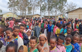 Children queueing for Mary's Meals food in Tigray