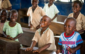 Children laughing in a classroom together