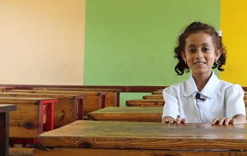 Child in Yemen in class waiting for Marys Meals
