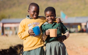 Image of children holding thier Mary's Meals