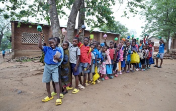 Children queueing for porridge, Malawi