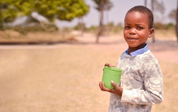 Image of a child holding their school meals