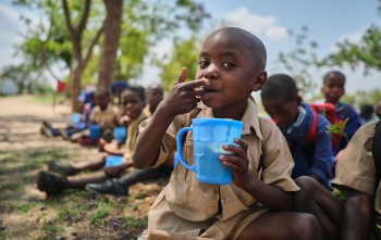 Children in Zambia eating their school meal