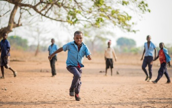 Falio in Zambia playing after his school meal
