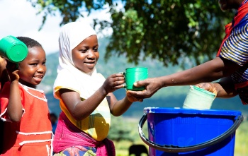 An image of children receiving thier school meal