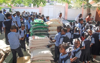 Image of food distribution at a school in Haiti