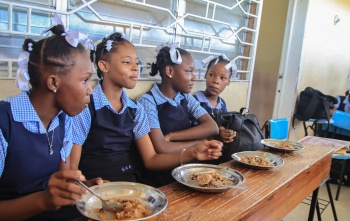 Girls in Haiti eating food together