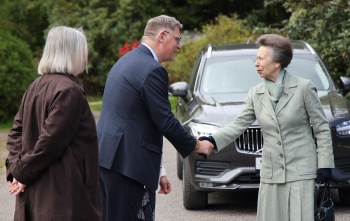 Magnus MacFarlane-Barrow shaking hands with Her Royal Highness The Princess Royal during a visit to Dalmally
