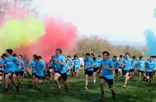 Fundraisers run among bright colours