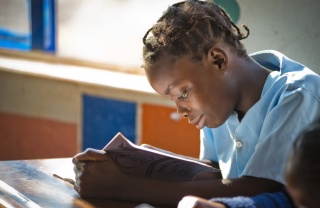 A girl in Liberia reads a book