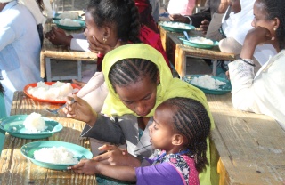 An Ethiopian mother feeds her child Marys Meals