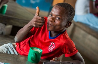 Child in Malawi enjoying Mary's Meals