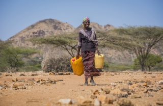 Rebecca carrying water in Kenya