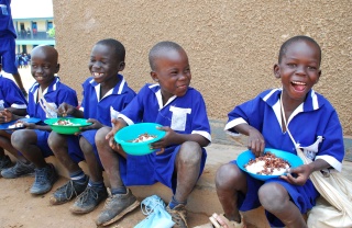 Children in Uganda eating their school meal