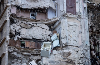 Kitchen cupboards visible within destroyed apartments from earthquake in Syria