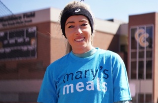 Eilish McColgan looks at camera while wearing Mary's Meals charity T-shirt