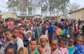 Children queueing for Mary's Meals food in Tigray