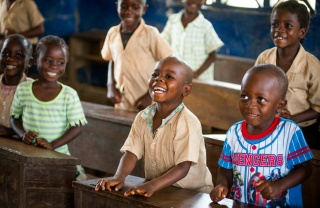 Children laughing in a classroom together