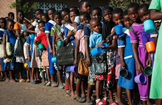 Children waiting on their school meals