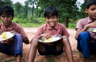 Boys eating Mary's Meals in India