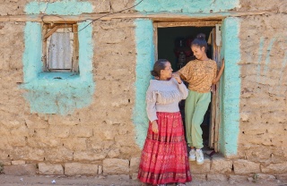 Lydia, right, and her mother, Shewit, left stand at an open doorway