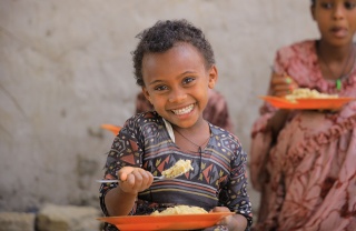 Image of child eating school meal