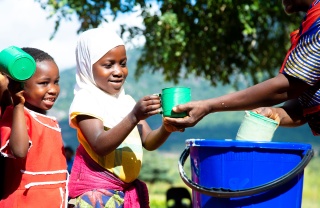 An image of children receiving thier school meal