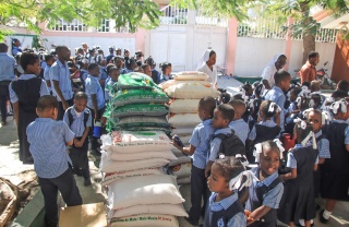 Image of food distribution at a school in Haiti