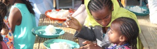 An Ethiopian mother feeds her child Marys Meals 