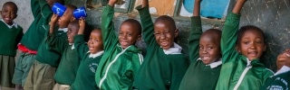 Children in Kenya waiting for their school meal