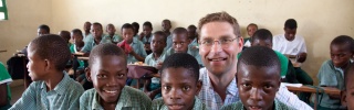 Magnus with children in Haiti