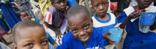 Children enjoying porridge in Malawi