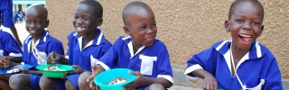 Children in Uganda eating their school meal