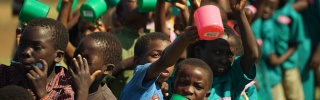 Children with their Mary's Meals mugs
