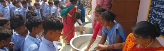 Children queuing to receive Mary's Meals 