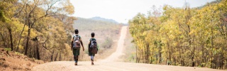 Girls walking to school to receive