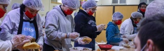 Volunteers for Dorcas preparing food 
