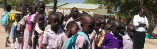 Children queueing for serving of Mary's Meals