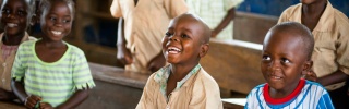 Children laughing in a classroom together