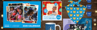 A selection of the Christmas gifts that can be found on the Mary's Meals online shop. Calendar, pin badges, gift cards, Christmas cards, dog bandana and mug.