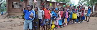 Children queueing for porridge, Malawi